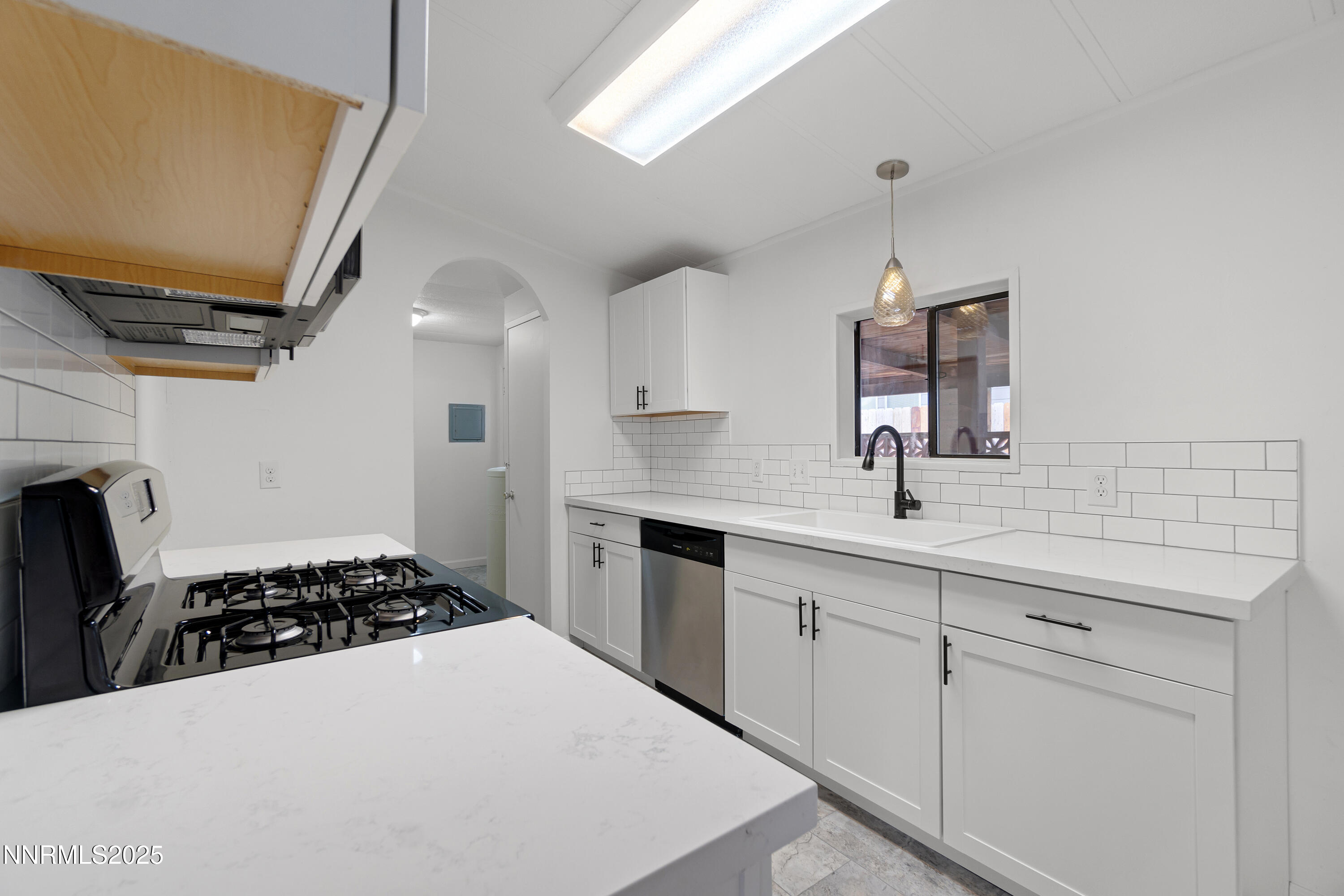 1025 Villa Way Fernley, NV 89408 - Photo 15 of 26 a kitchen with a sink appliances and cabinets