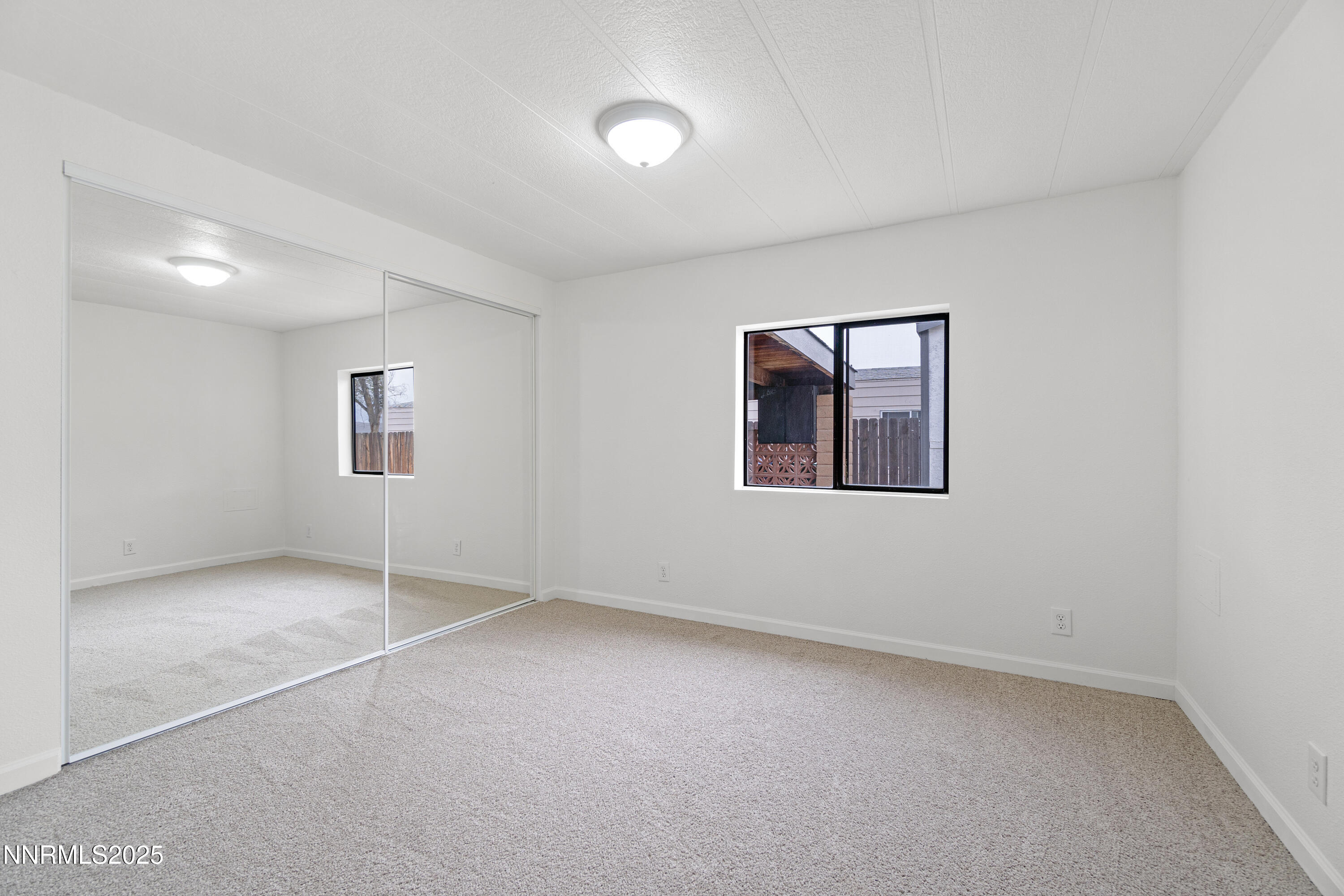 1025 Villa Way Fernley, NV 89408 - Photo 18 of 26 an empty room with windows