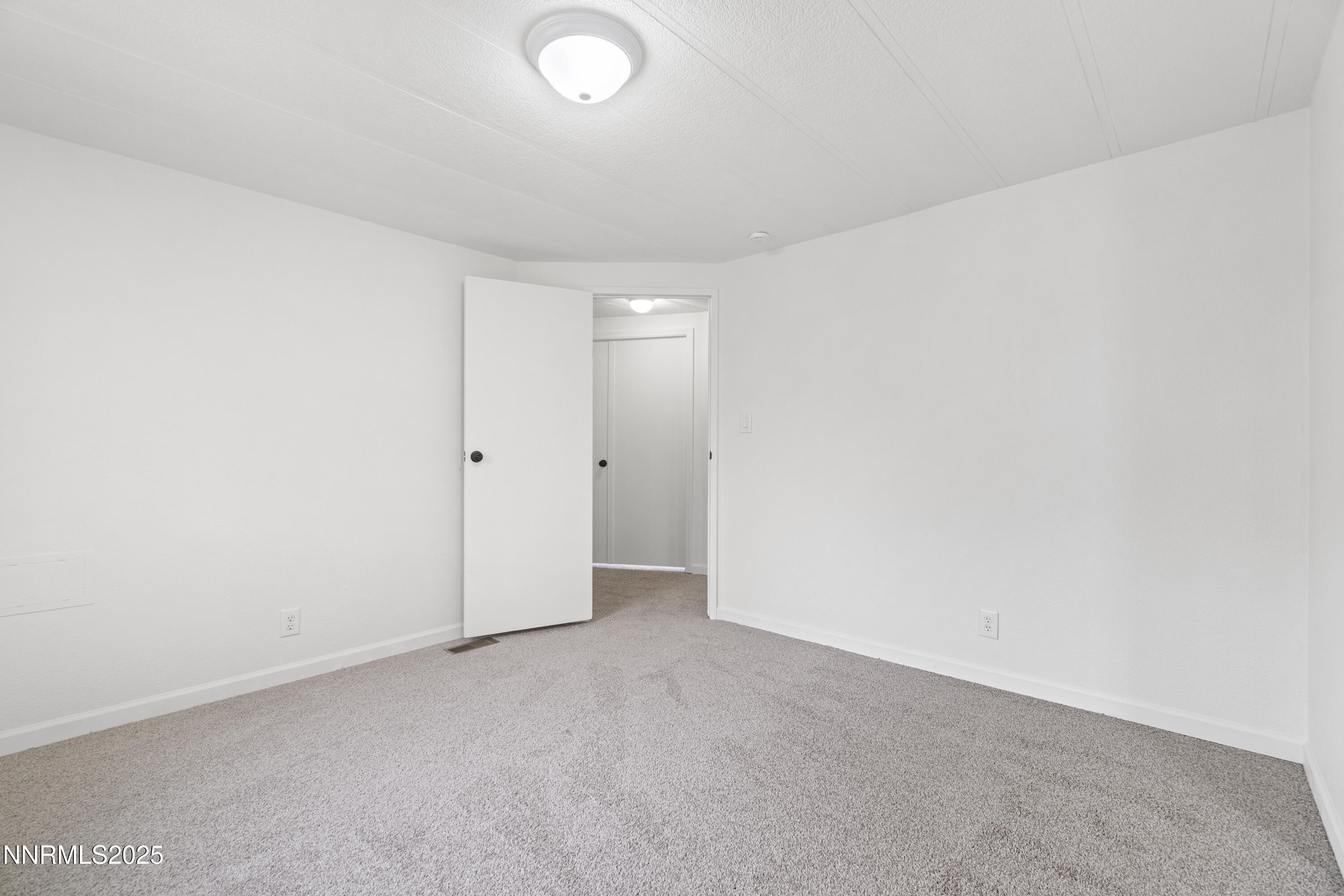 1025 Villa Way Fernley, NV 89408 - Photo 19 of 26 a view of an empty room