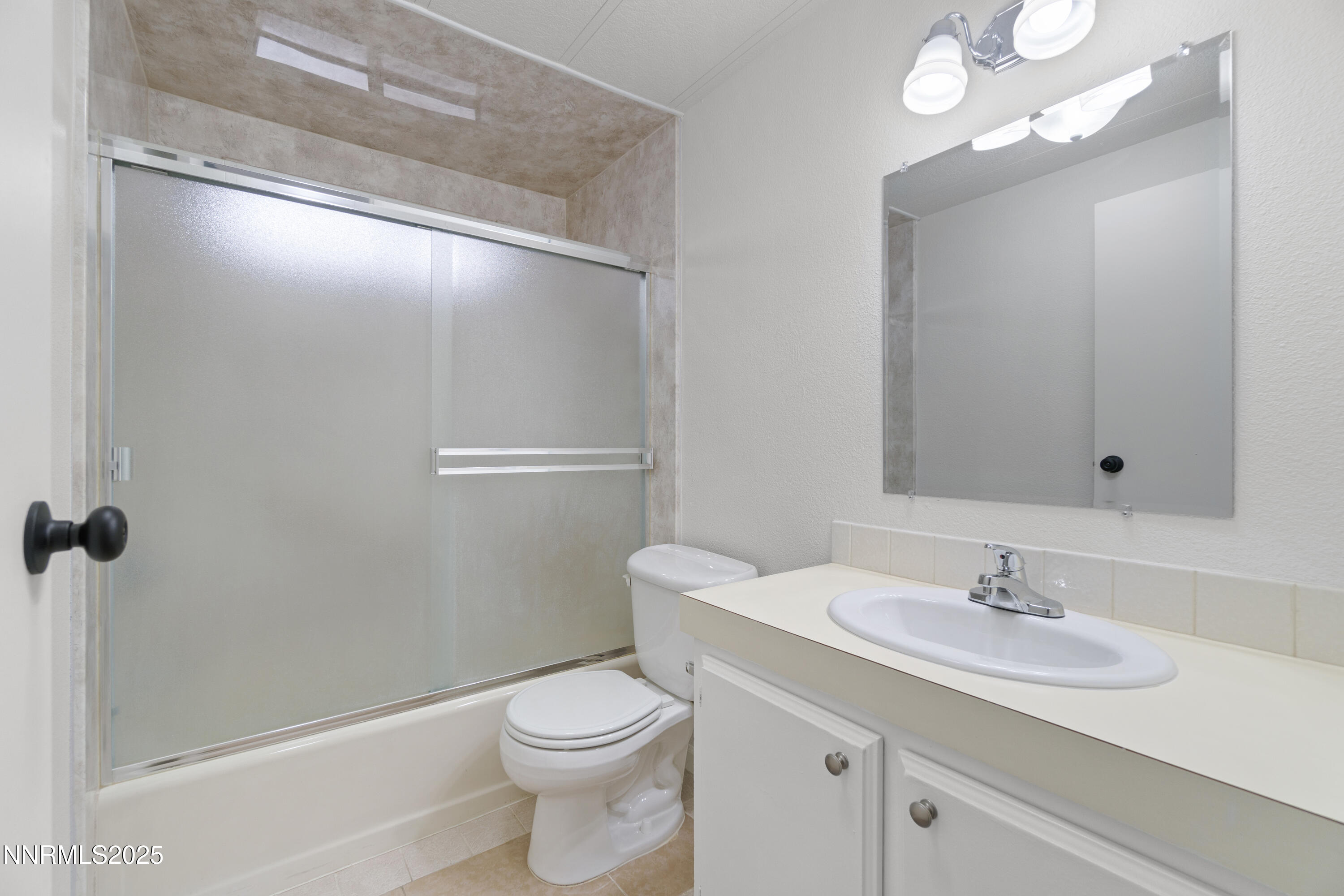 1025 Villa Way Fernley, NV 89408 - Photo 20 of 26 a bathroom with a sink a toilet and shower
