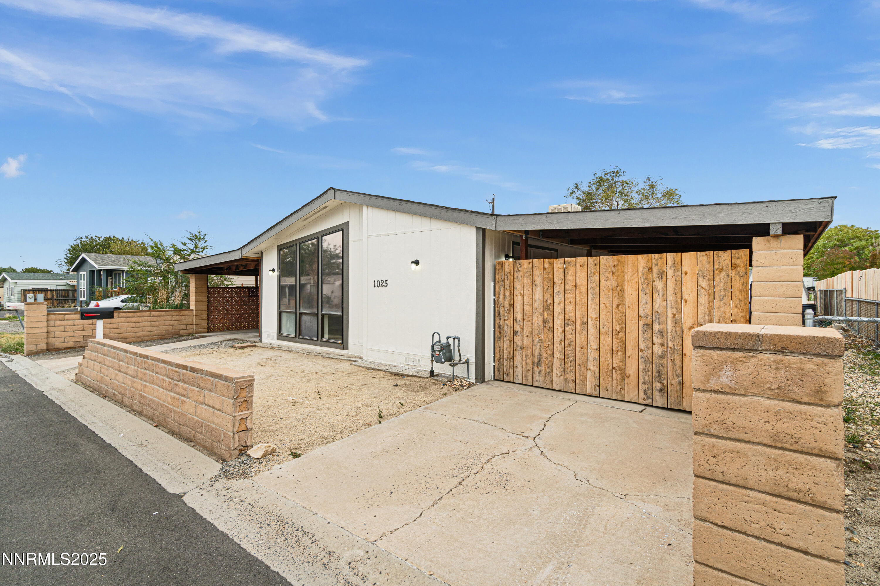 1025 Villa Way Fernley, NV 89408 - Photo 2 of 26 a spacious bedroom with a bed and a window