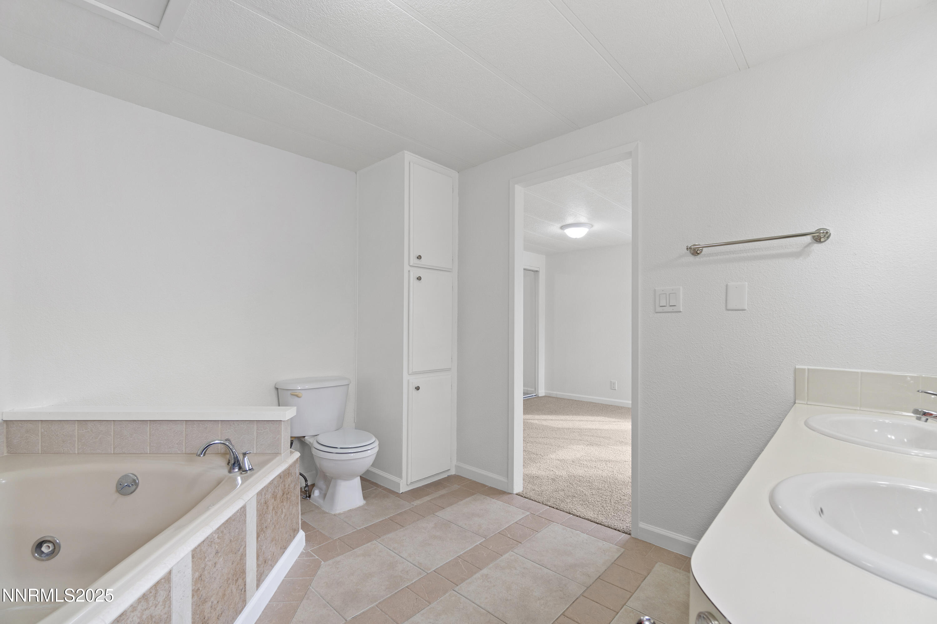 1025 Villa Way Fernley, NV 89408 - Photo 26 of 26 a bathroom with a tub sink and toilet