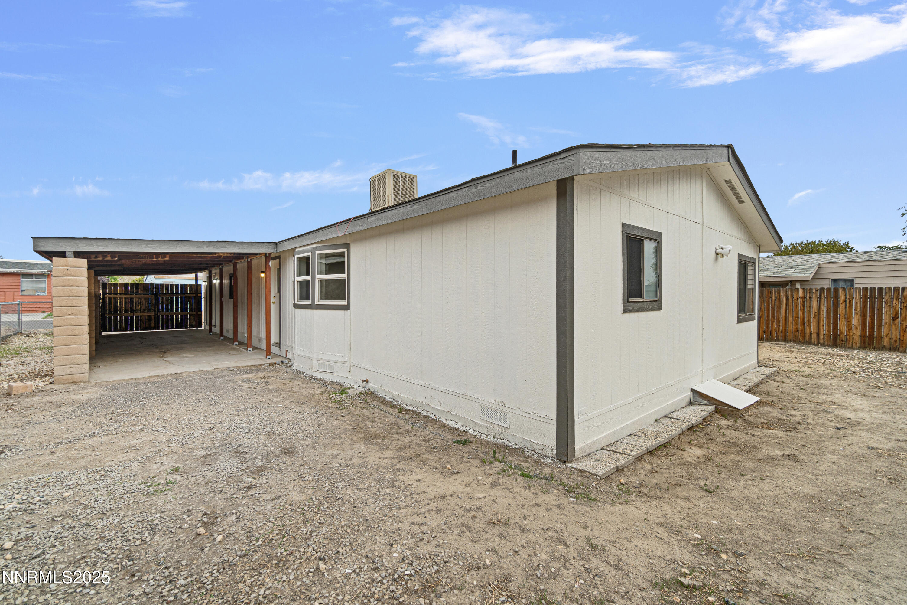 1025 Villa Way Fernley, NV 89408 - Photo 7 of 26 a view of a house with a backyard