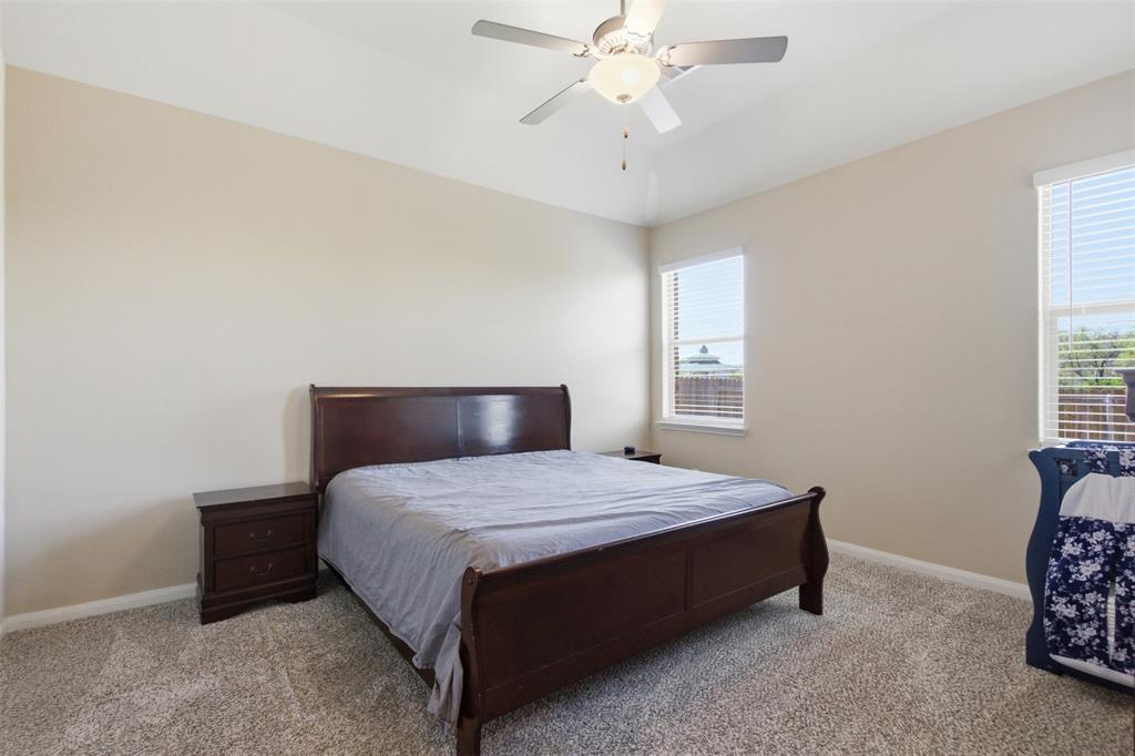 292 Wandering Stream Way Princeton, TX 75407 - Photo 24 of 40 Bedroom with carpet, a ceiling fan, and vaulted ceiling