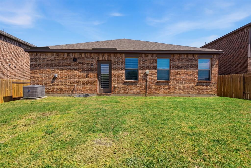 292 Wandering Stream Way Princeton, TX 75407 - Photo 36 of 40 Back of property featuring brick siding and a shingled roof