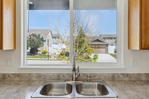 a bathroom with a sink and a window