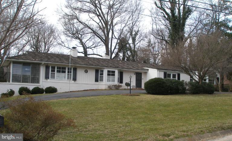1324 Pine Tree Road McLean, VA 22101 - Photo 1 of 23 a front view of a house with a garden and porch