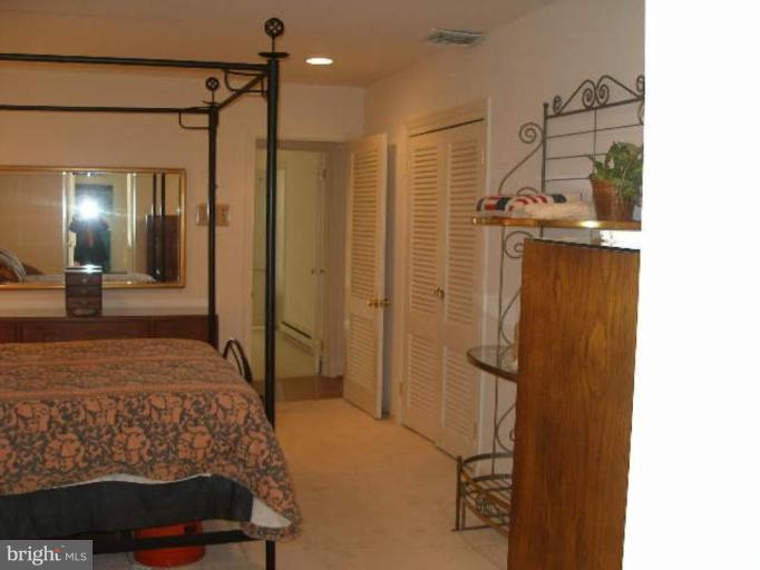 1324 Pine Tree Road McLean, VA 22101 - Photo 17 of 23 a bedroom with a bed and a mirror