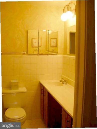 1324 Pine Tree Road McLean, VA 22101 - Photo 20 of 23 a bathroom with a sink mirror and toilet