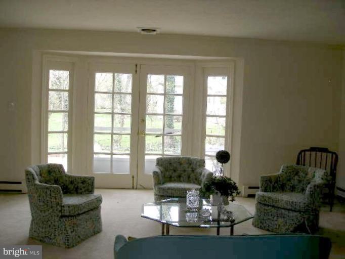 1324 Pine Tree Road McLean, VA 22101 - Photo 6 of 23 a living room with furniture and a large window
