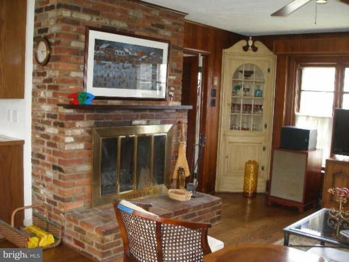 1324 Pine Tree Road McLean, VA 22101 - Photo 9 of 23 a living room with furniture a window and a fireplace