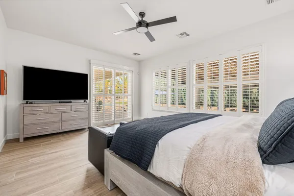 a bedroom with bed and a couch