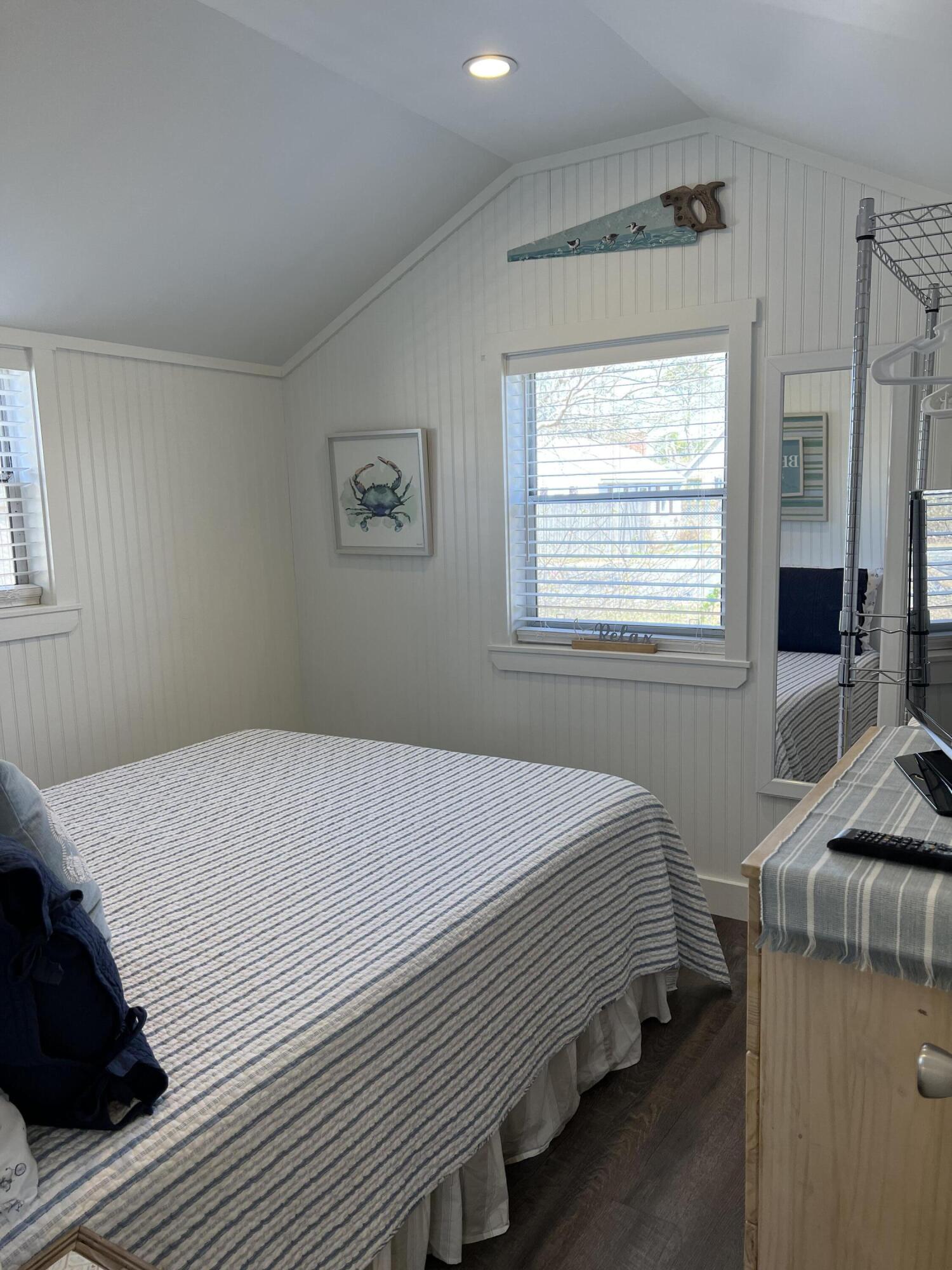 209 Lower County Road Dennis Port, MA 02639 - Photo 12 of 39 a bedroom with a bed and a window