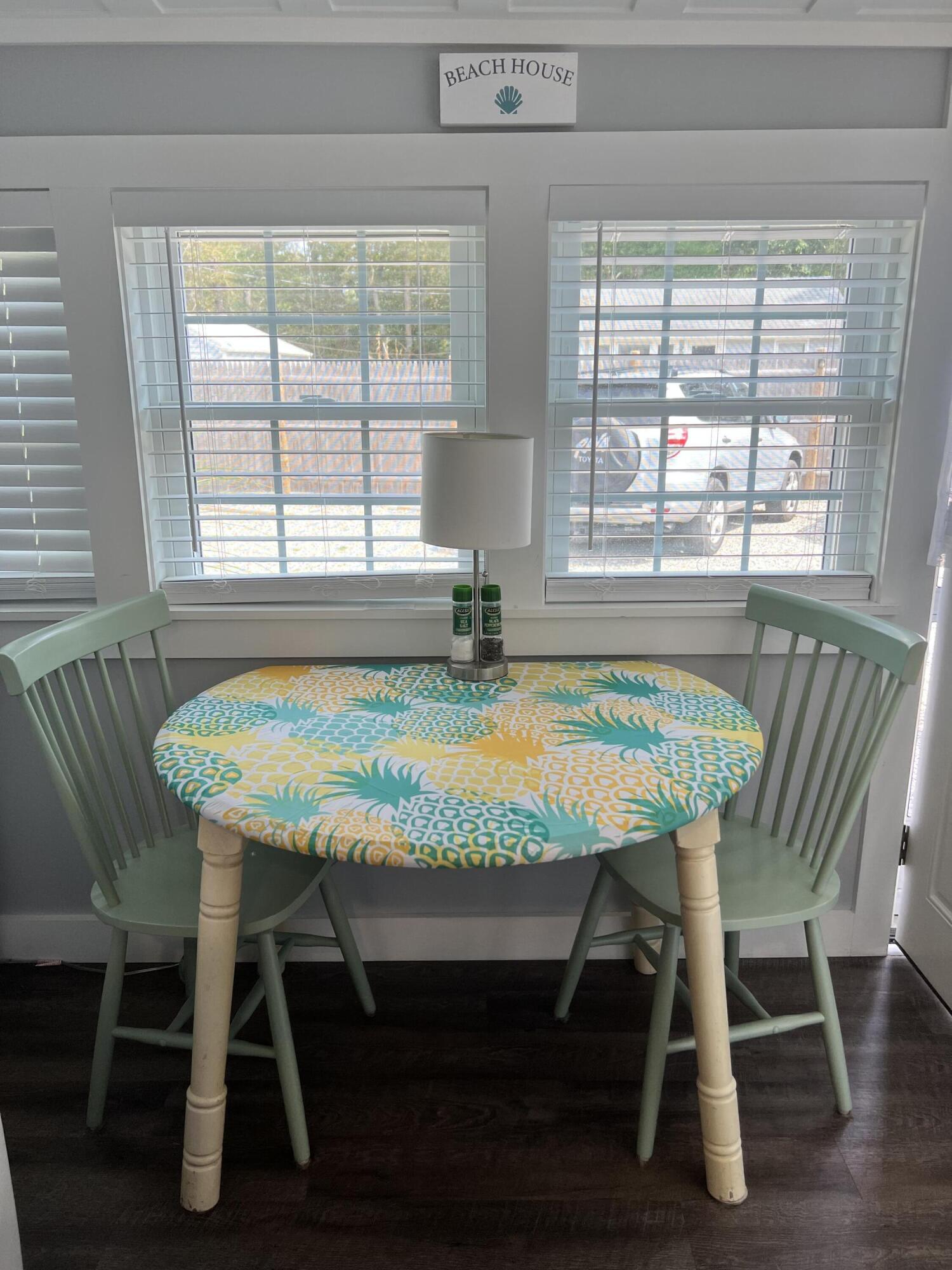 209 Lower County Road Dennis Port, MA 02639 - Photo 13 of 39 a table and chairs in a room