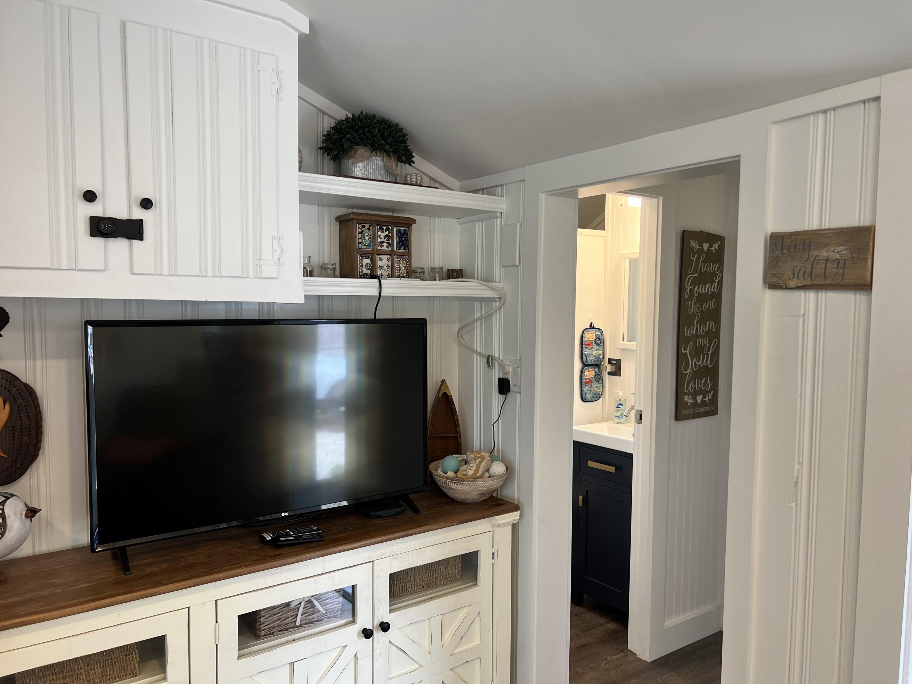 209 Lower County Road Dennis Port, MA 02639 - Photo 21 of 39 a kitchen with stainless steel appliances a stove and a microwave