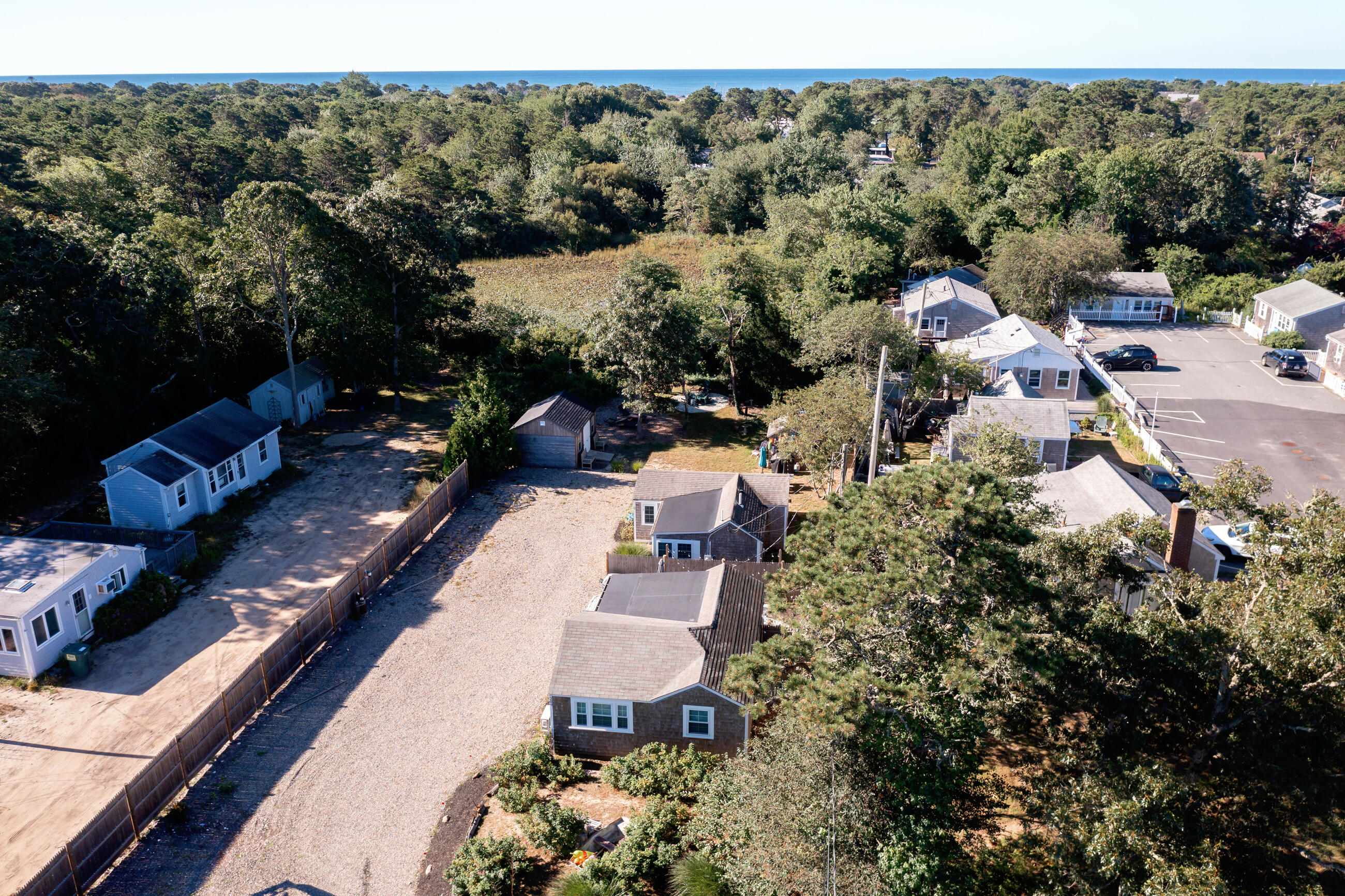 209 Lower County Road Dennis Port, MA 02639 - Photo 23 of 39 an aerial view of a house with a yard