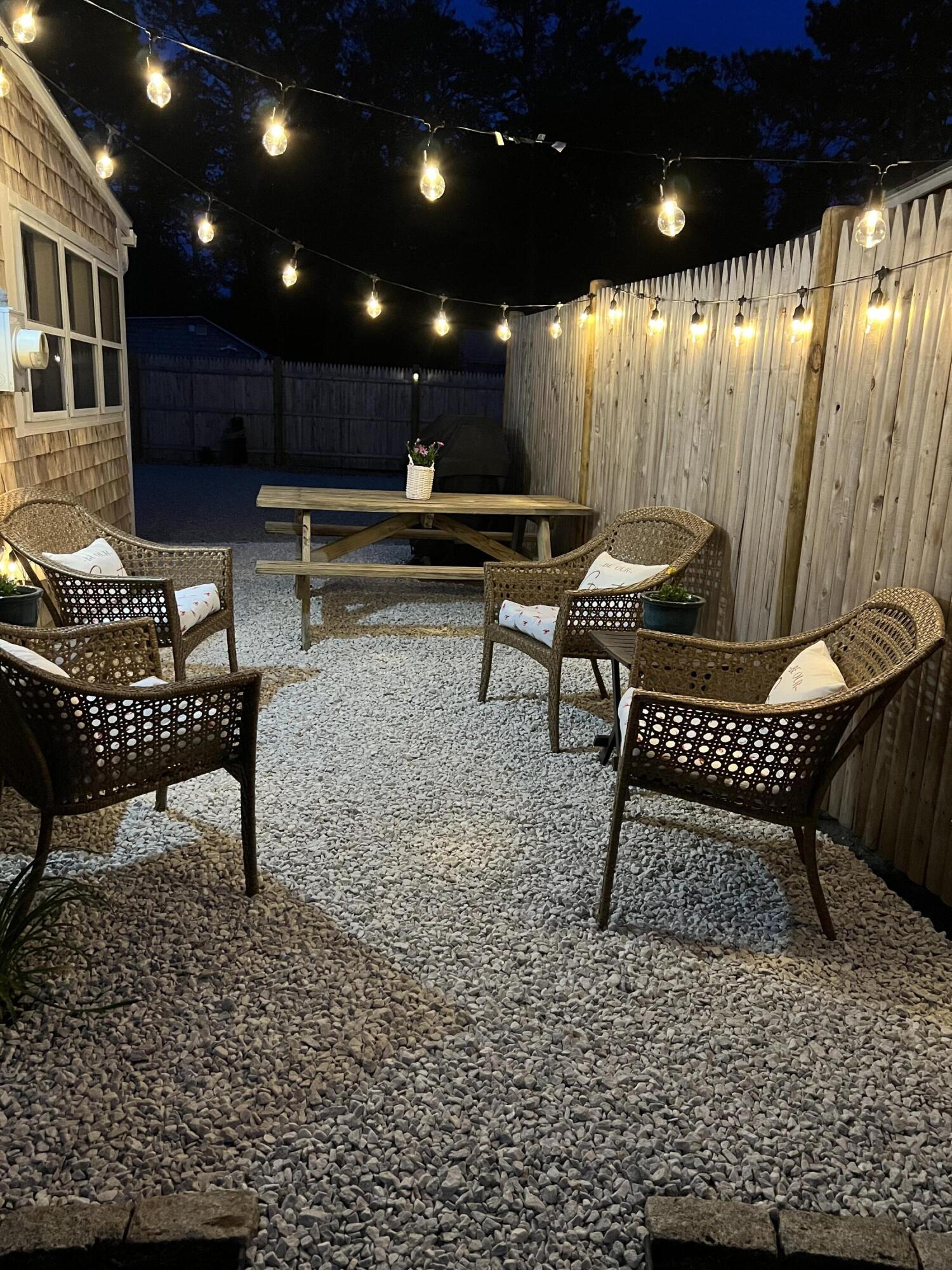 209 Lower County Road Dennis Port, MA 02639 - Photo 25 of 39 a view of a chairs in wooden floor