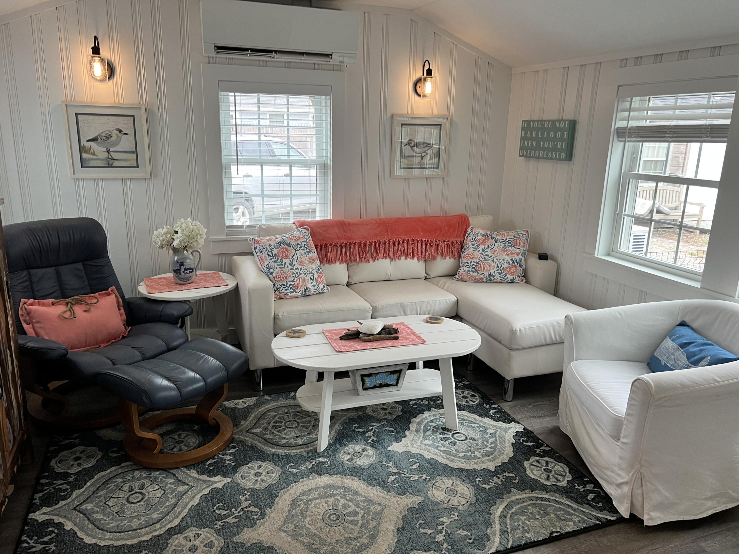 209 Lower County Road Dennis Port, MA 02639 - Photo 26 of 39 a living room with furniture and a window