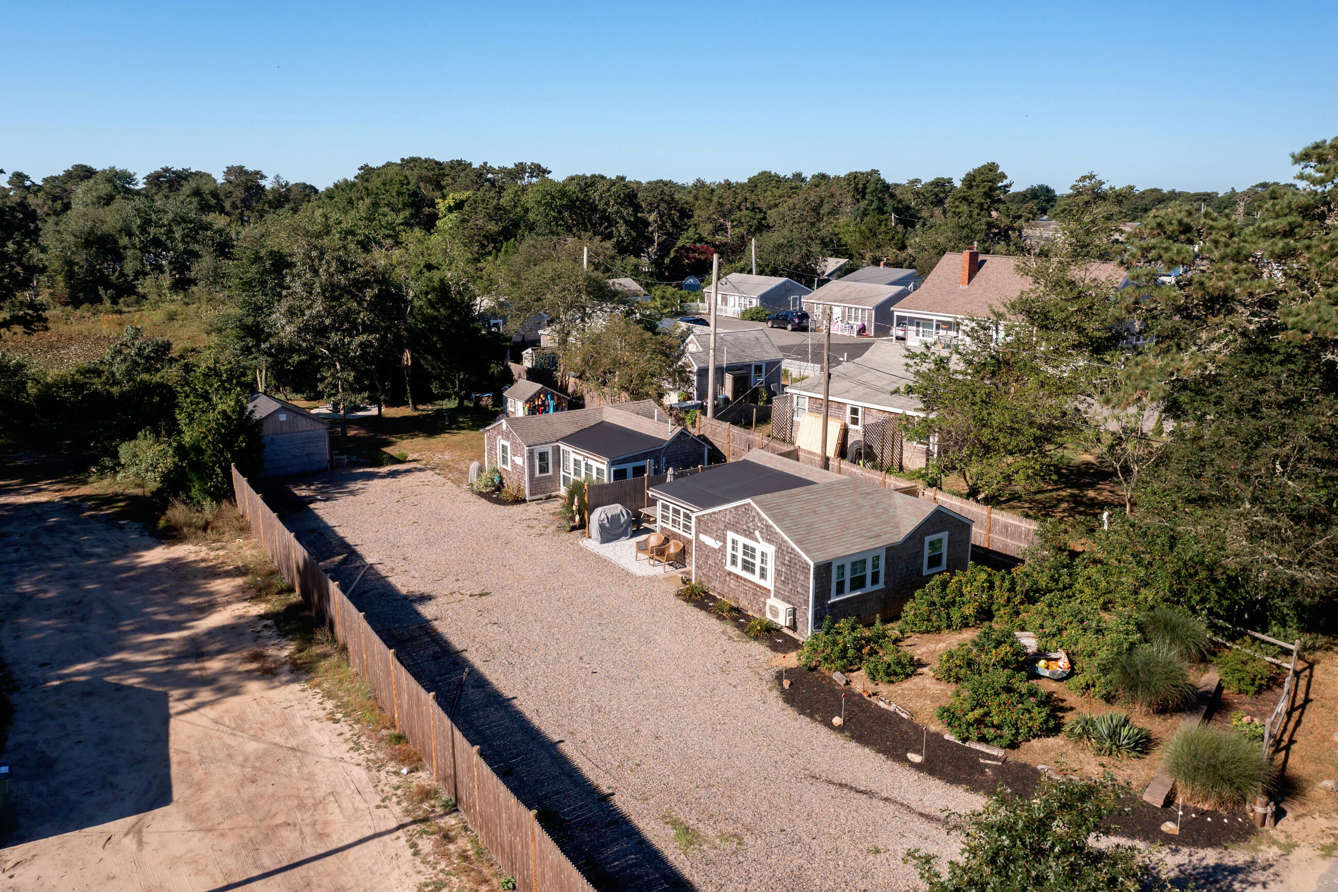 209 Lower County Road Dennis Port, MA 02639 - Photo 35 of 39 an aerial view of a house with yard swimming pool and mountain view