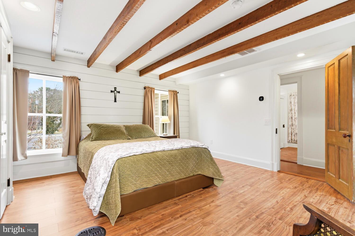 7651 Main Street Tilghman, MD 21671 - Photo 17 of 30 a bedroom with a bed and a large window