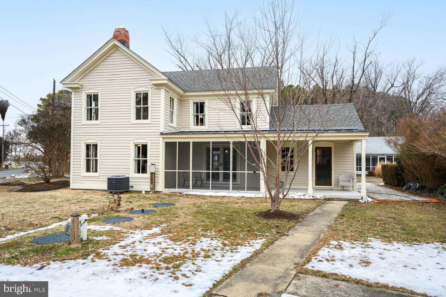 7651 Main Street Tilghman, MD 21671 - Photo 2 of 30 a front view of a house with a yard
