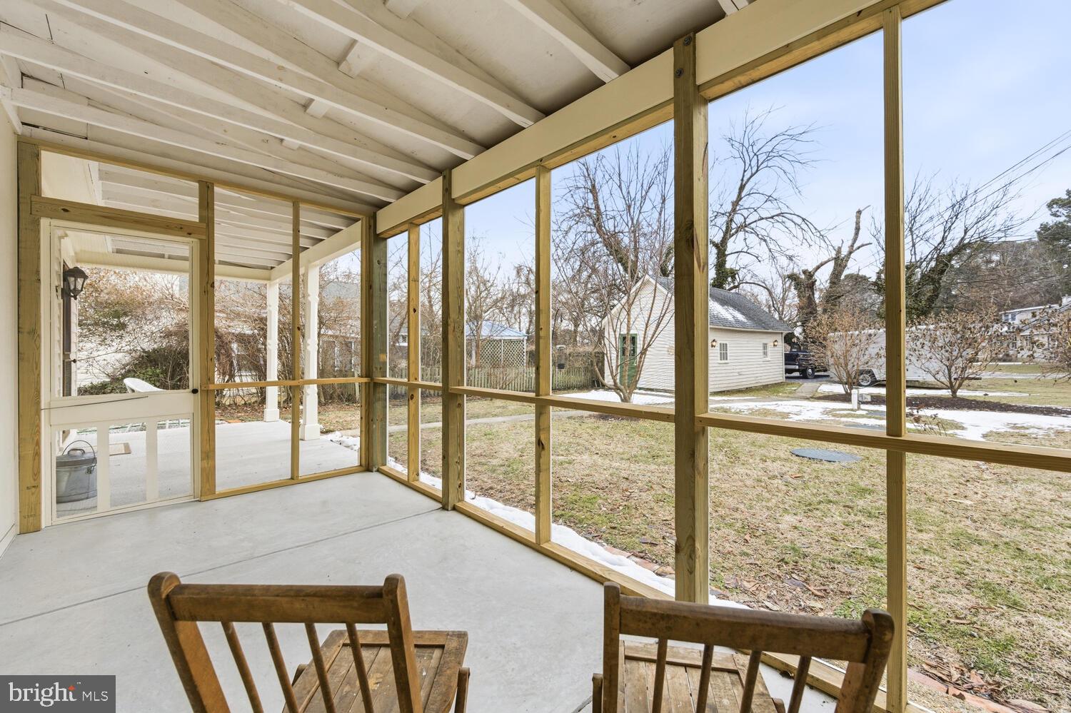 7651 Main Street Tilghman, MD 21671 - Photo 24 of 30 a view of a glass door with a tv from a window