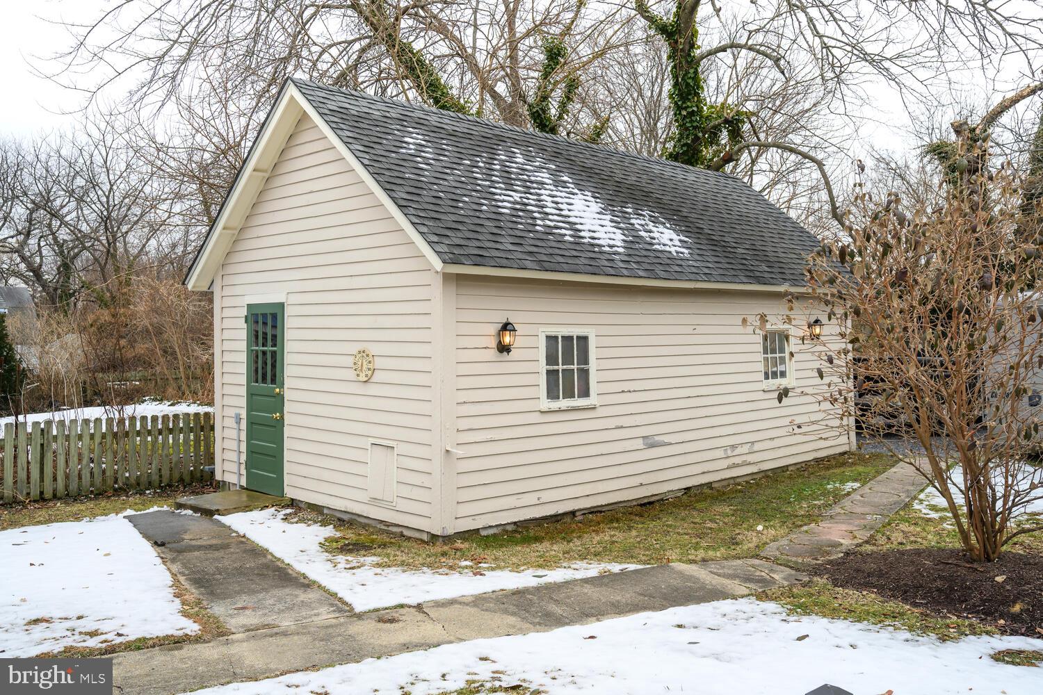 7651 Main Street Tilghman, MD 21671 - Photo 27 of 30 a view of a white house with a small yard