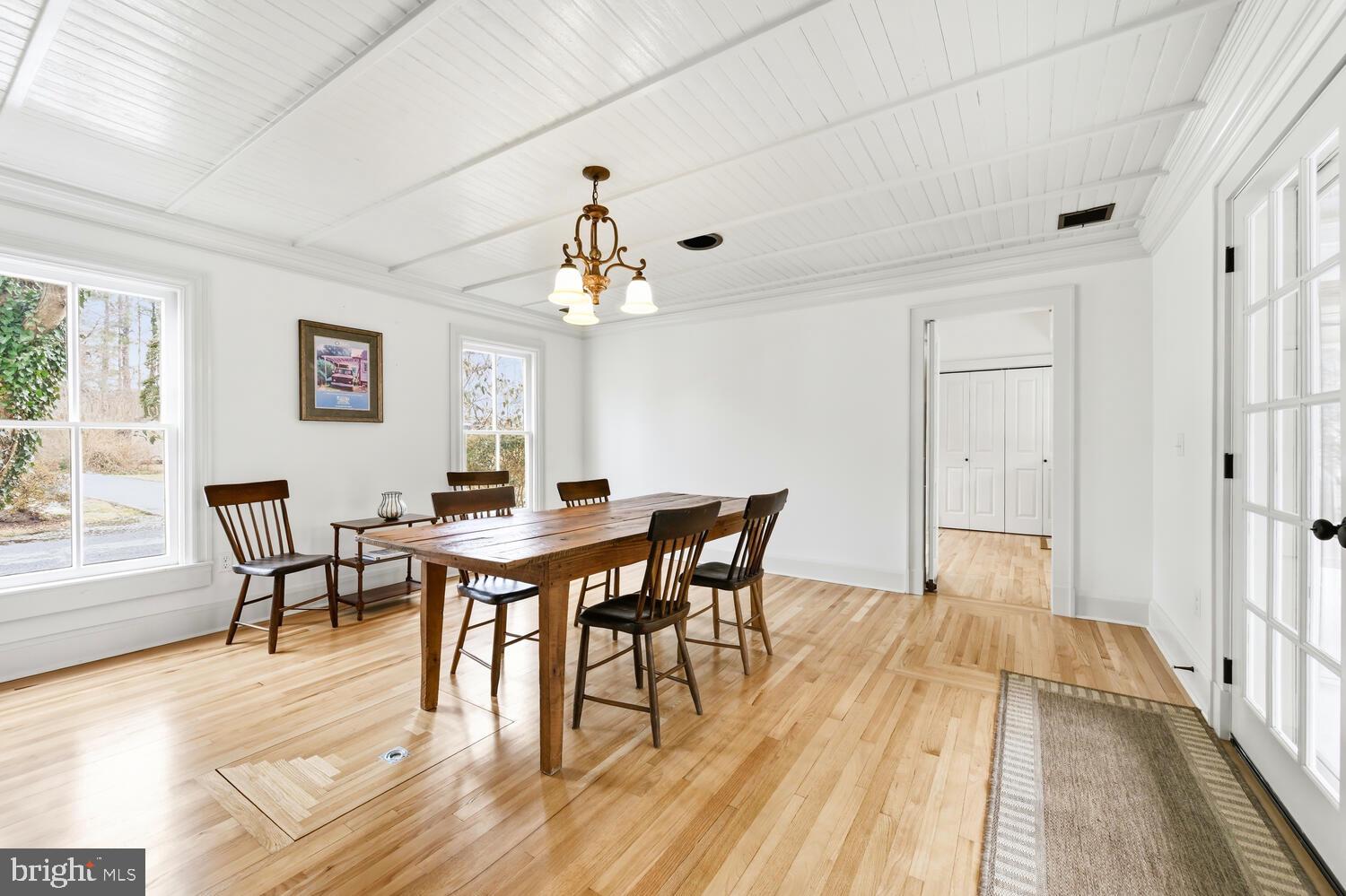 7651 Main Street Tilghman, MD 21671 - Photo 6 of 30 a view of a dining room with furniture and wooden floor