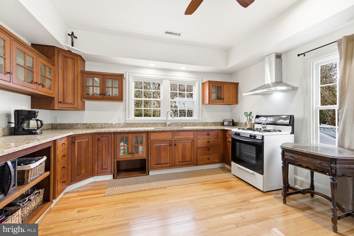 7651 Main Street Tilghman, MD 21671 - Photo 8 of 30 a kitchen with stainless steel appliances granite countertop a stove a sink dishwasher and a refrigerator