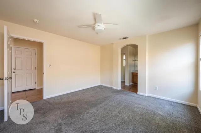 a bathroom with a granite countertop sink mirror and shower