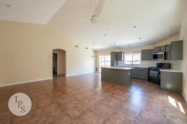 a kitchen with a sink a counter top space and appliances