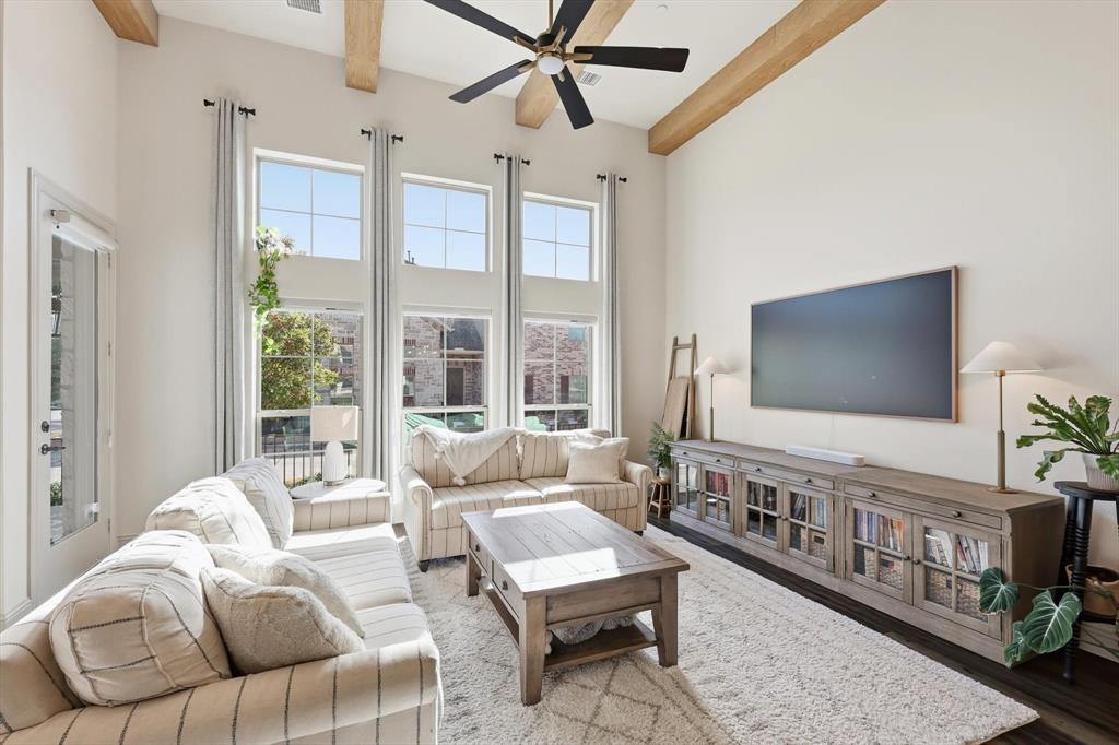 401 Lavender Lane Fairview, TX 75069 - Photo 11 of 40 a living room with furniture and a flat screen tv