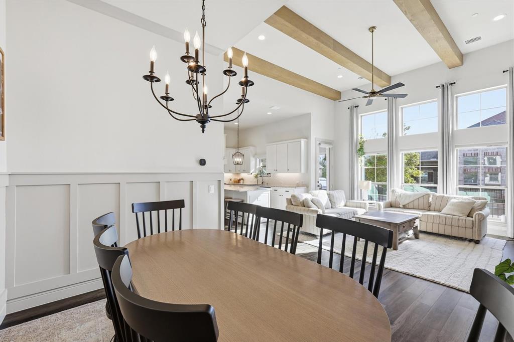 401 Lavender Lane Fairview, TX 75069 - Photo 15 of 40 a view of a dining room and livingroom with furniture wooden floor a chandelier