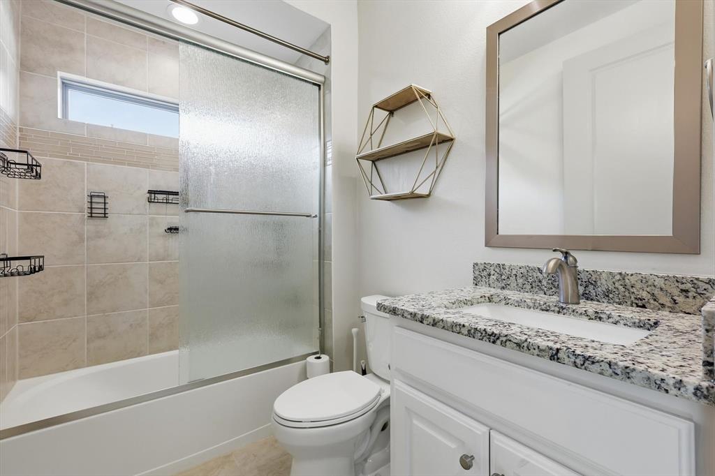 401 Lavender Lane Fairview, TX 75069 - Photo 32 of 40 a bathroom with a sink toilet and shower