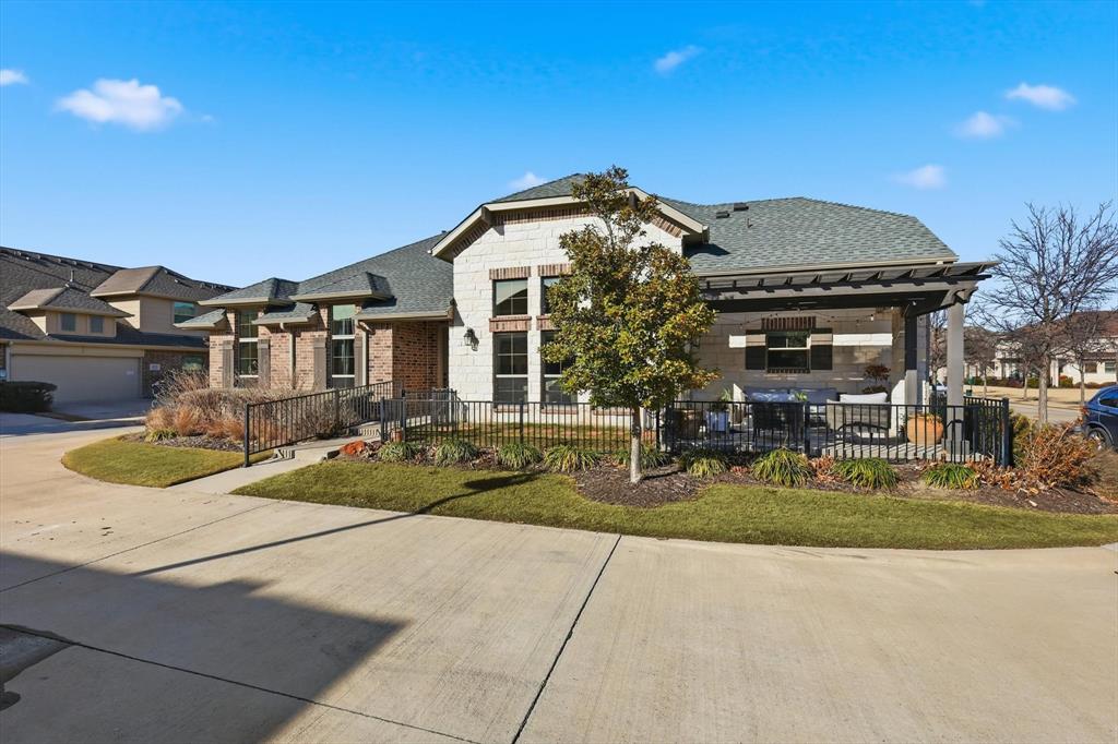 401 Lavender Lane Fairview, TX 75069 - Photo 5 of 40 a front view of a house with garden