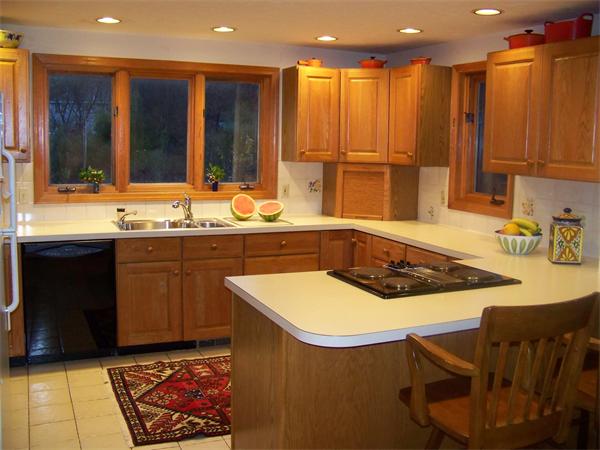43 Garvey Road Framingham, MA 01701 - Photo 9 of 29 a kitchen with a sink and cabinets