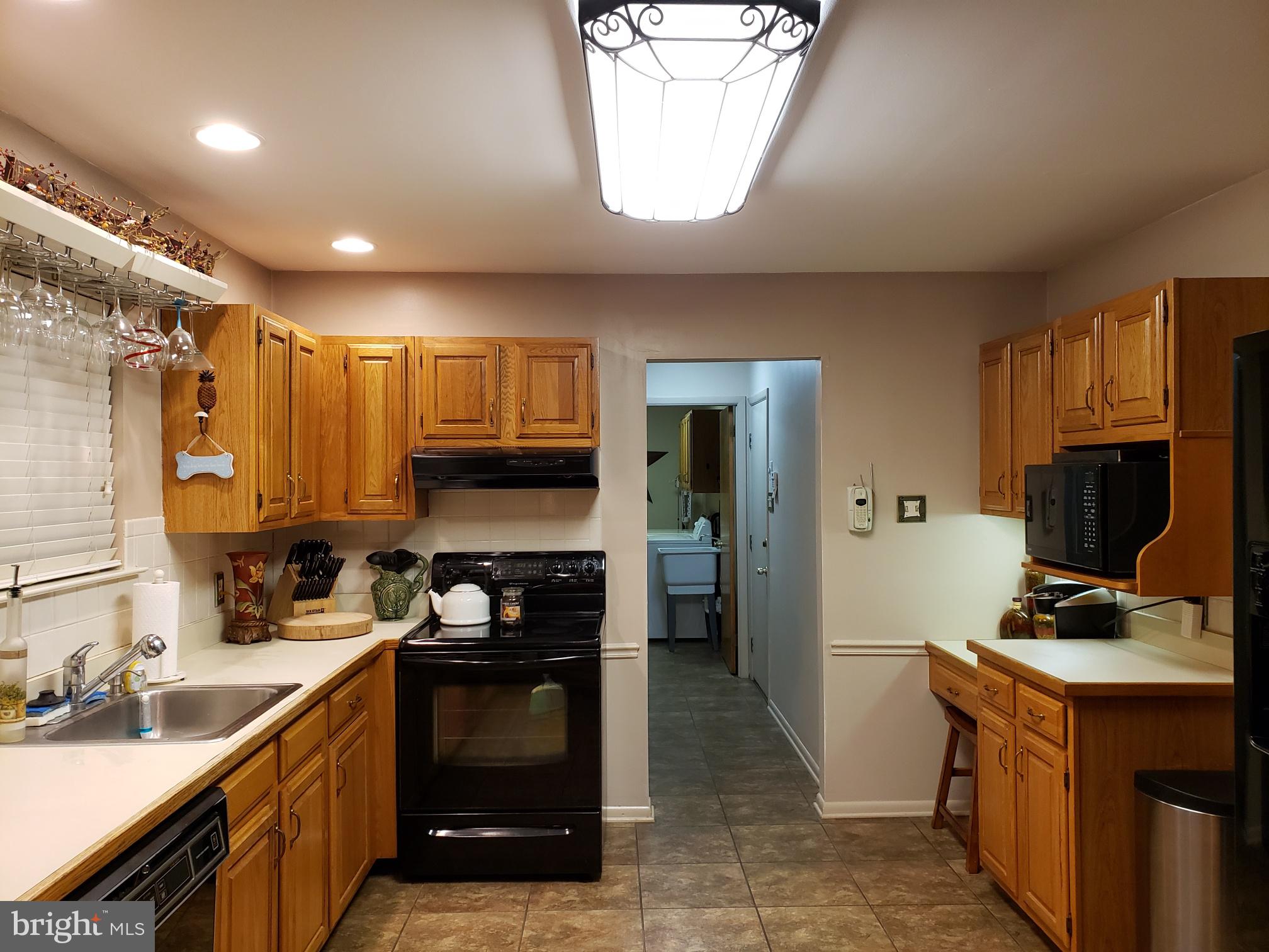 534 Farnum Road Media, PA 19063 - Photo 12 of 43 a kitchen with a sink stove and refrigerator