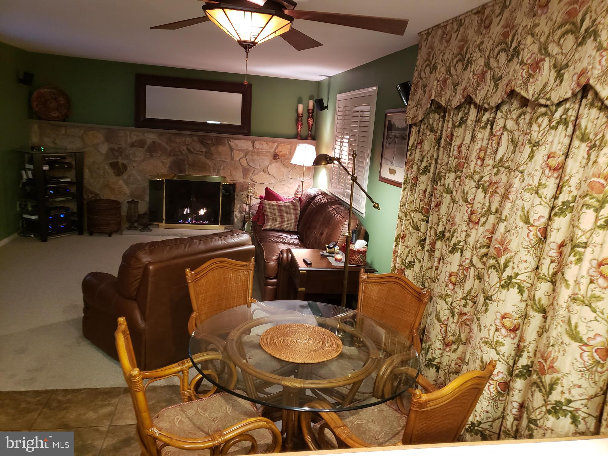 534 Farnum Road Media, PA 19063 - Photo 15 of 43 a living room with a couch and a fireplace