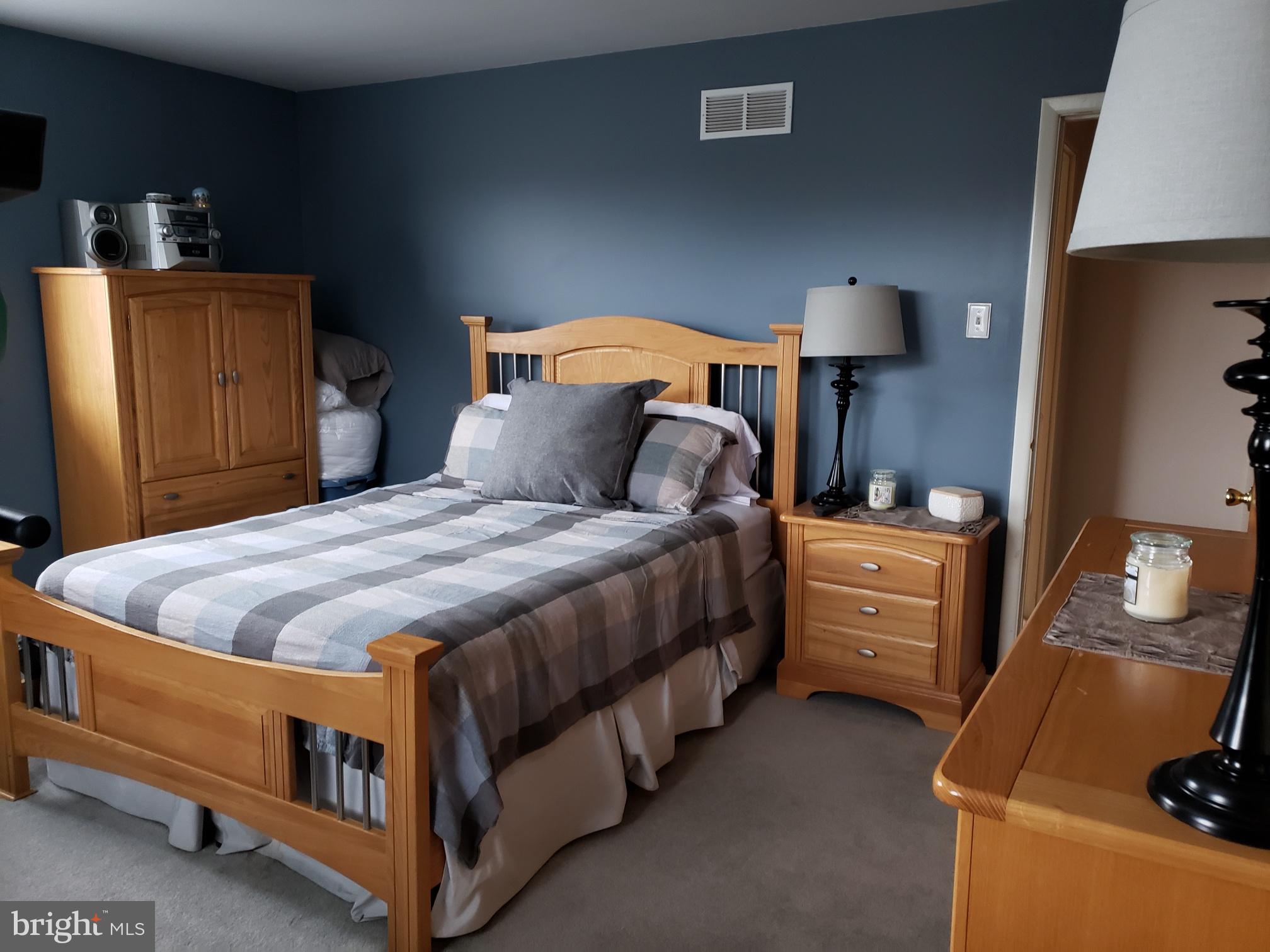 534 Farnum Road Media, PA 19063 - Photo 31 of 43 a bed room with a bed and a lamp