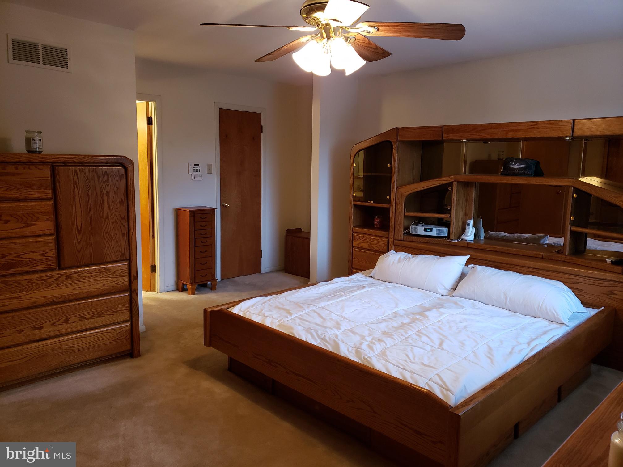 534 Farnum Road Media, PA 19063 - Photo 38 of 43 a bedroom with a bed and a flat tv screen on dresser