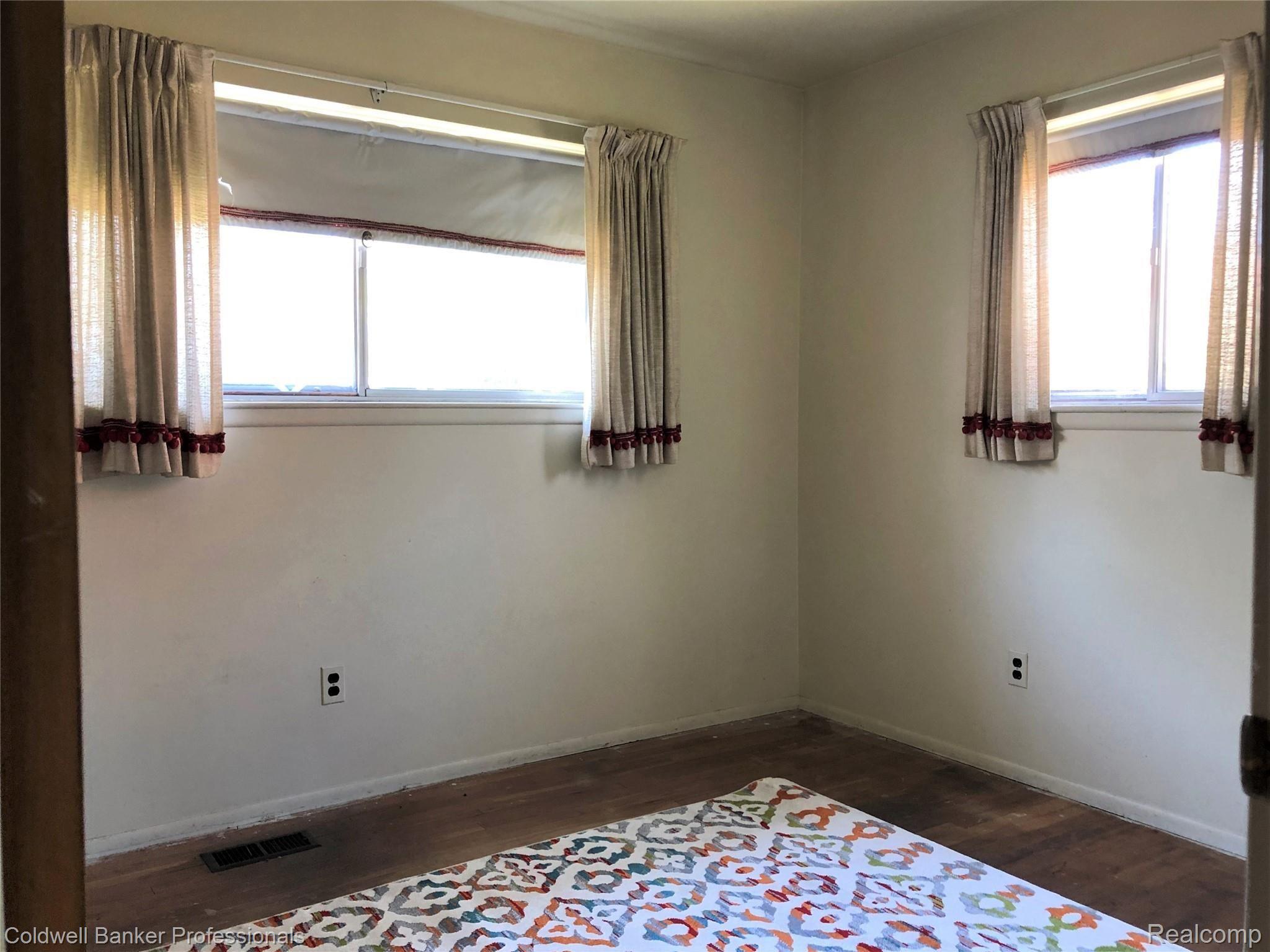 29934 Rambling Road Southfield, MI 48076 - Photo 9 of 11 Bedroom- carpet removed to expose wood flooring!