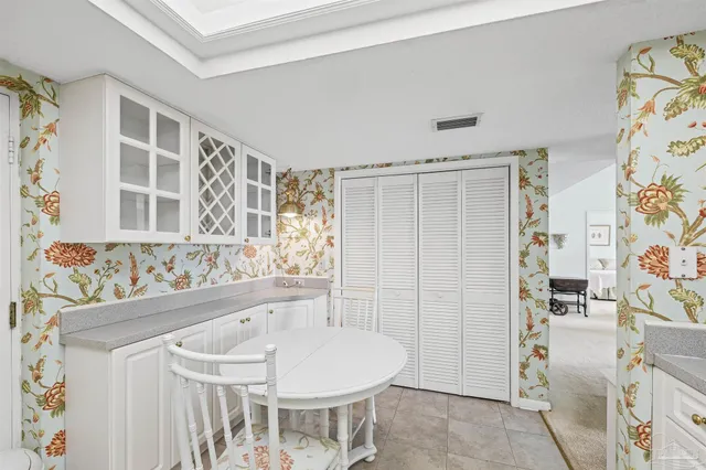 a kitchen with stainless steel appliances granite countertop a sink a stove and cabinets