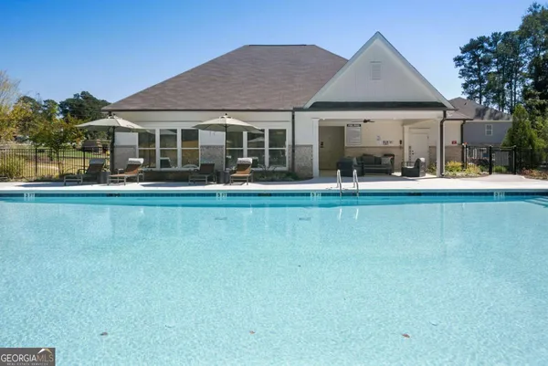 a view of a patio with swimming pool