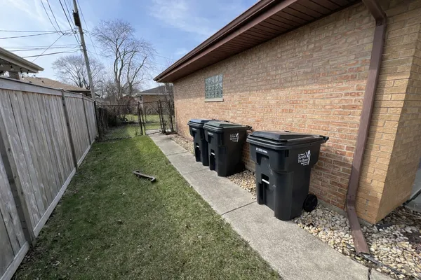 a view of a pathway of a house with backyard