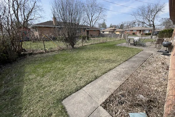 a view of backyard with green space