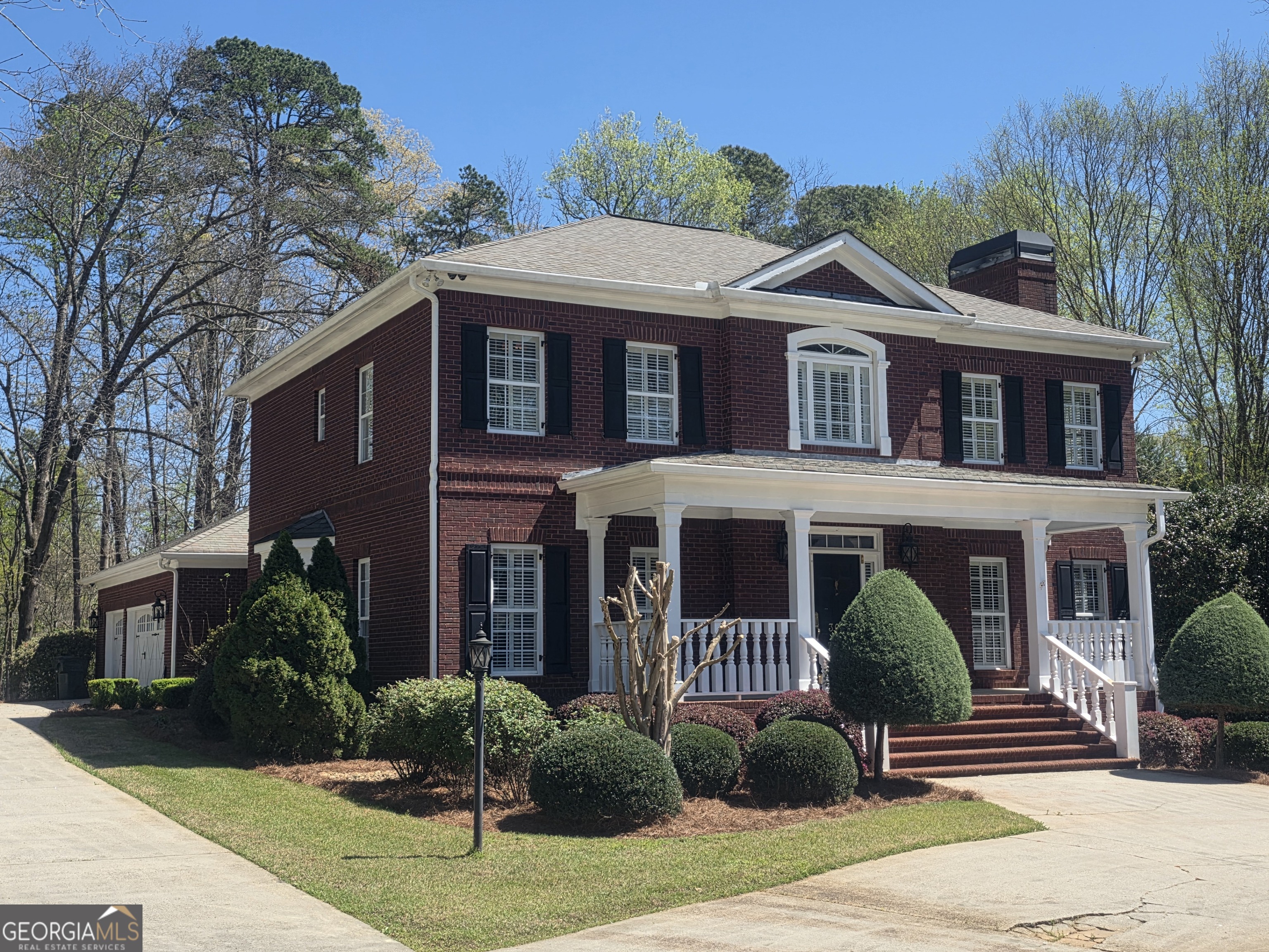 306 Calumet Lane Monroe, GA 30655 - Photo 5 of 13 a front view of a house with garden