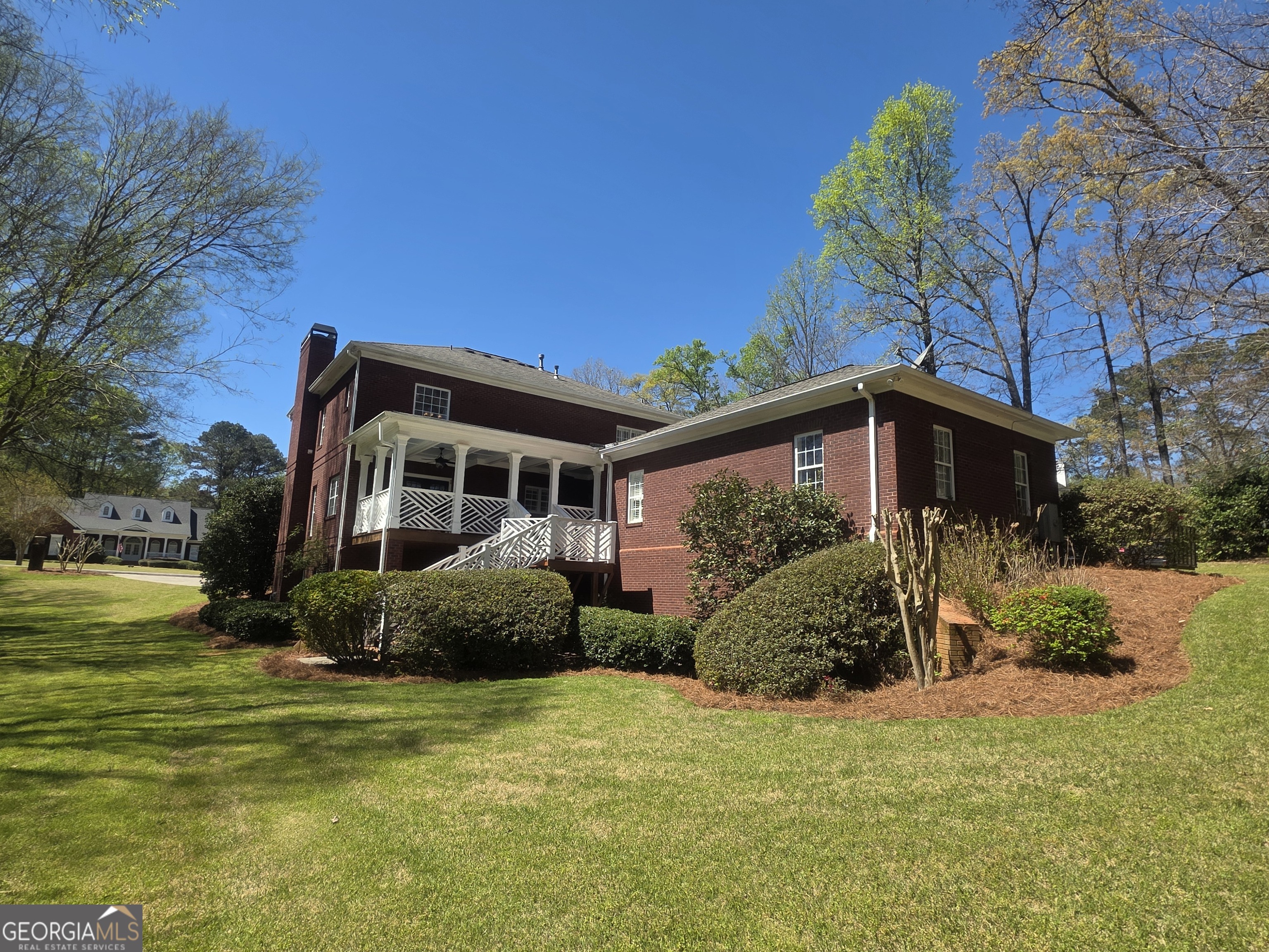306 Calumet Lane Monroe, GA 30655 - Photo 9 of 13 a front view of a house with garden