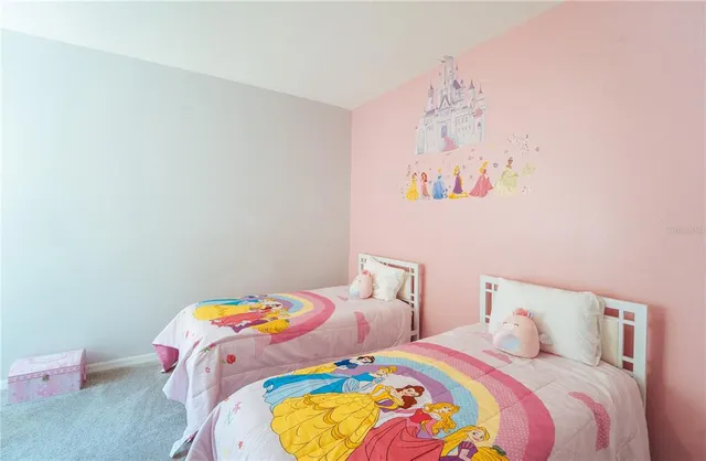 a bedroom with bed and wooden floor