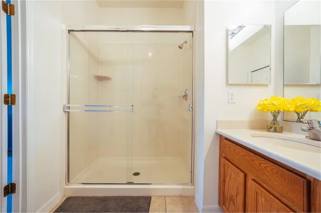 a bathroom with a sink mirror vanity and toilet