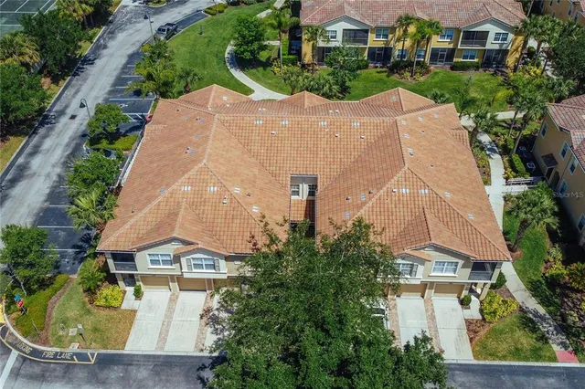 an aerial view of residential house with outdoor space and swimming pool
